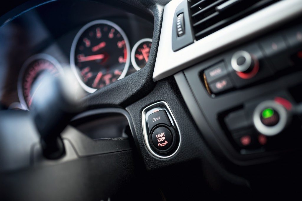 close-up of car start and stop button. Modern car interior with