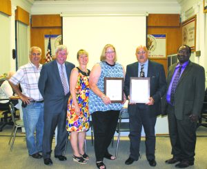 Joan Romagnoli (third, right) and Joseph Armocida (second, right) are pictured with, from left: David Del Santo, David Fowler and Laura Ferone and Patrick Emeagwali