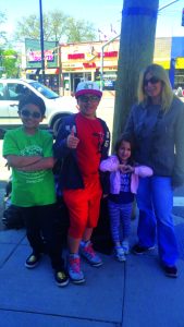 With the help of three children, Bellerose Terrace resident Jill Popolizio filled up four 55-gallon contractor bags with garbage that had been illegally dumped curbside on Jericho Turnpike by some local business owners.