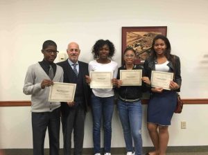 Superintendent of Schools Dr. Ralph Ferrie is pictured with Floral Park Memorial honorees (from left): Rian Wannamaker, Sabrina Louis, Aquaria Branch and Uchenna Egbujor.