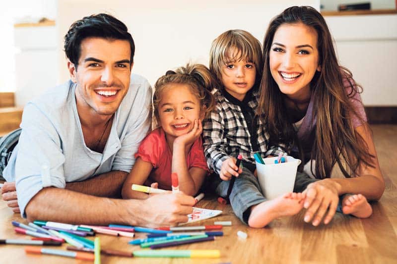 Young happy family drawing