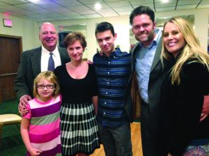 Laura DeStefan (far left), receives her new hearing aids from funds raised at the Night of Musical Talent event, pictured with (from left) Kurt, Debbie and Kyle Meyfohrt, Justin and Kristi Osmond.