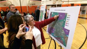 Residents look over proposed zoning maps at the Hicksville Downtown Revilatization meeting. (Photos by Chris Boyle)