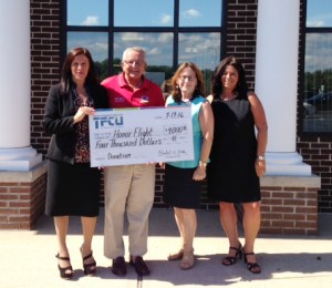 A donation check for $4,000 raised by TEAM TFCU was presented to Honor Flight, a nonprofit organization based in Southampton, at TFCU’s Riverhead Branch. Pictured are (lt. to rt.) are Santa Rodriguez of TFCU, Bill Jones and Virginia Bennett of Honor Flight and Jennifer Gunn of TFCU.  