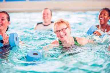 Senior Adult Woman Working Out in the Pool