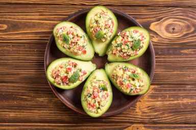 Avocado stuffed with cucumber , tomatoes and eggs