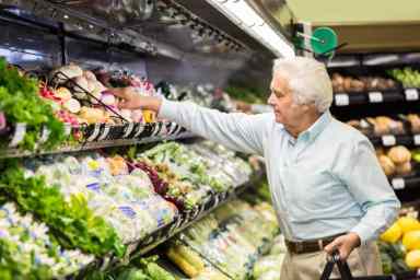 Senior man shopping for healthy food in grocery store