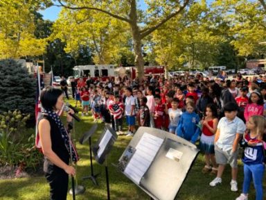 24-013 East Hills students sang songs during the ceremony commemorating 911