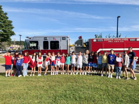 24 013 Harbor Hill students in front of Roslyn Highlands firetruck 445x334 1