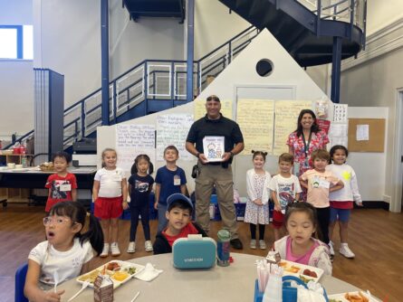 24 013 Heights first graders presented letters thanking firefighters and police officers 445x334 1