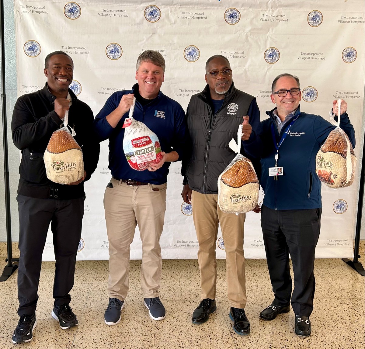 Village of Hempstead Deputy Mayor Jeffery Daniels,Harris Beach Long Island Office Managing Partner Thomas J. Garry, Village of Hempstead Mayor Waylyn Hobbs Jr. and Mercy Hospital President Joseph Manopella.