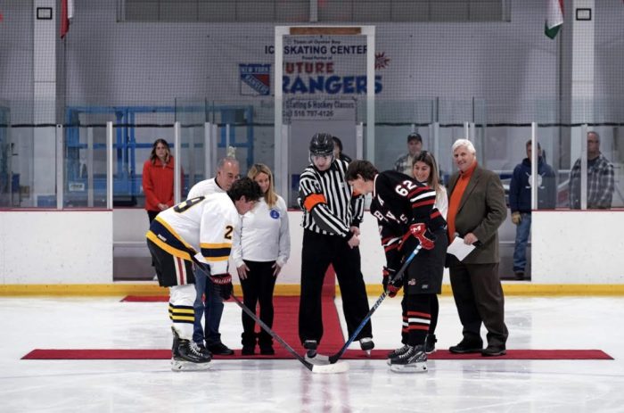 Sabrina Nav Mem Foundation HS Hockey Night 2023 Pic Teams Faceoff Photo 1 smaller file e1731516372678