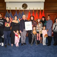 Nassau County Executive Bruce Blakeman, center left, awards Shye Roberts, center right, for her achievement on Season 26 of "The Voice"