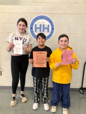 Harbor Hill students with their Thanksgiving letters.