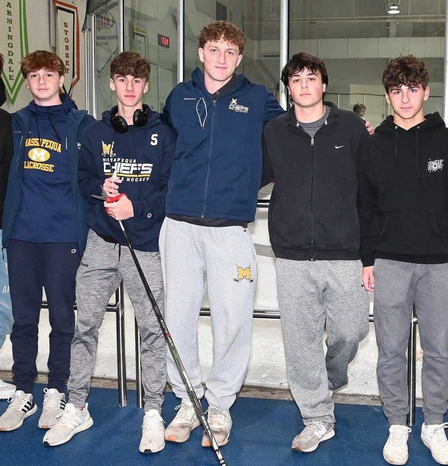 Connor Kasin, center, dies during charity hickey match on Saturday, Nov. 30.