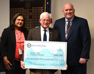 Assemblymember Lavine with Hicksville Schools Superintendent Dr. Theodore Fulton and Sunita Manjrekar, Board of Education Vice President at the Board of Education meeting, December 18, 2024