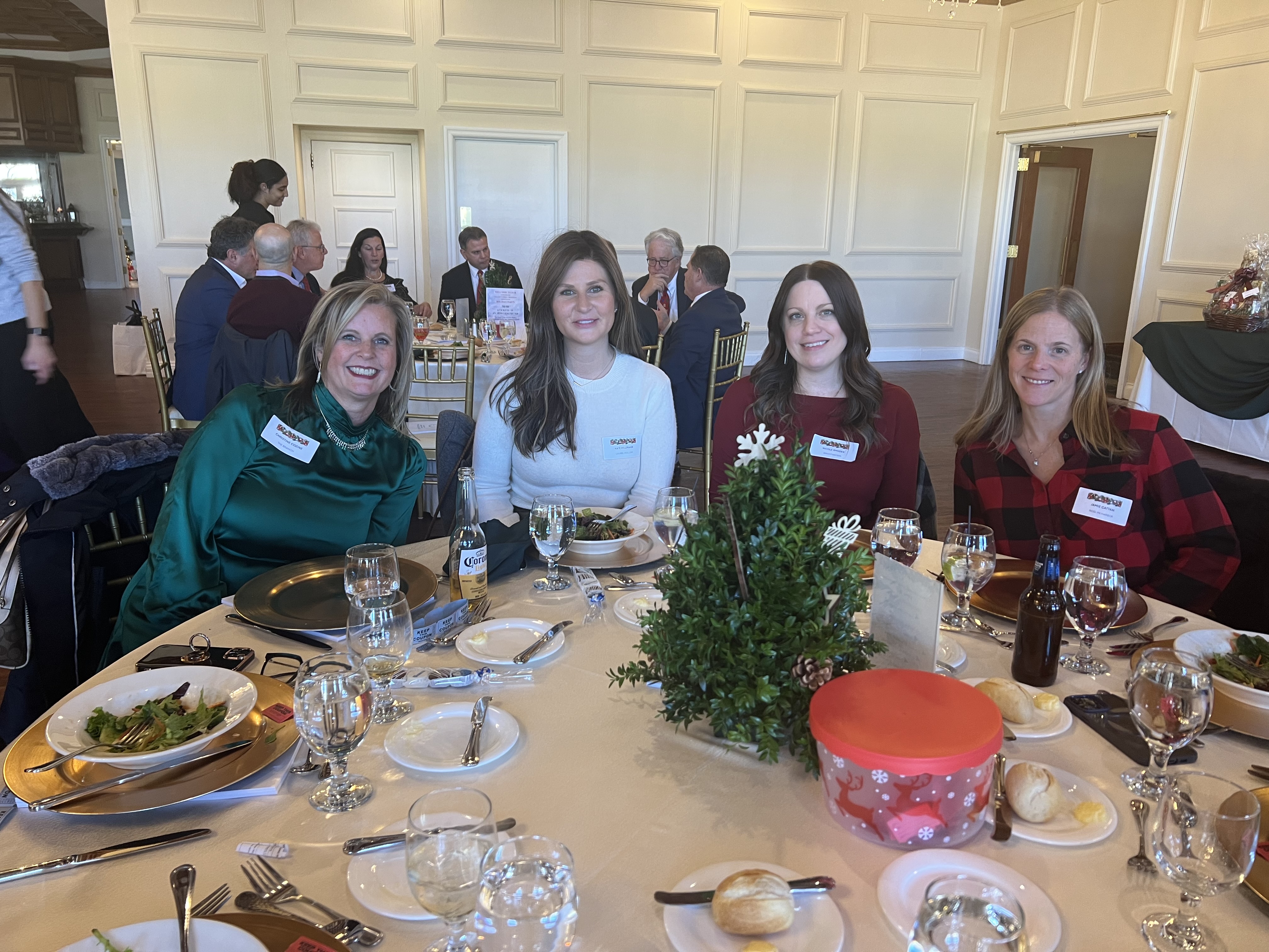 Christine Cozine, Kate Hillmann, Nicole Rhodes, and Jamie Cattani at the Long Island Village Clerks and Treasurers Association's annual Holiday Luncheon and Toy Collection.