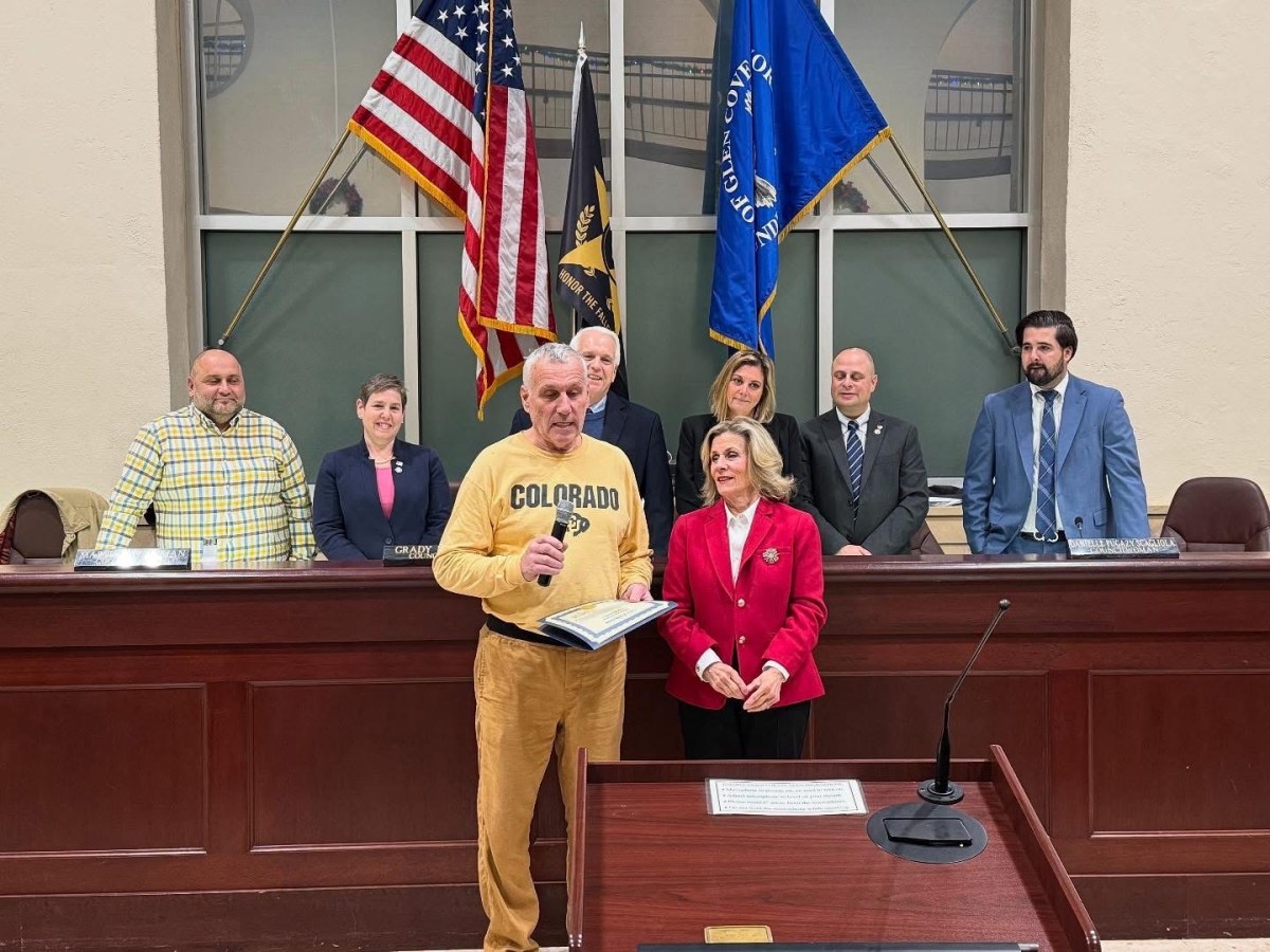 Kevin Kern accepts a citation from the city in celebration of Landing Bakery's 65th anniversary