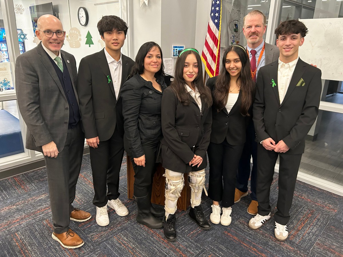 Pictured from left to right, Superintendent of Schools Kenneth R. Bossert, Mason Yeung, Leah Zelaya and her mother, Anishka Arolkar, South High Interim Principal Adam Hopkins and Charlie Gorenstein