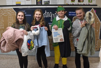 Seaford Middle School Service Club members from left, Jovie Hartmann, Mila Rogdakis, Ryan Kind and Angela O’Brien helped organize a winter clothing drive for the St. Vincent de Paul Society, which runs through Jan. 10.