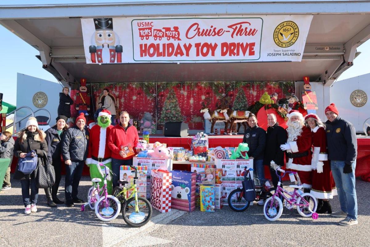 Town officials join the Marines at the 'Cruise-Thru' Toy drive, collecting 36,000 toys