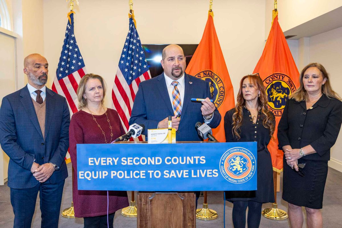 Legislator Scott Davis, Legislator Debra Mulè, Legislator Seth Koslow, Georgina Cornago, and Legislator Delia DeRiggi-Whitton announced a bill that would require Nassau police to carry EpiPens with them.