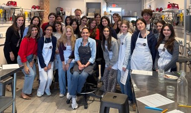 Manhasset High School students and Italian teachers with Cooking Lab owner Michelle Capobianco during their Italian cooking class