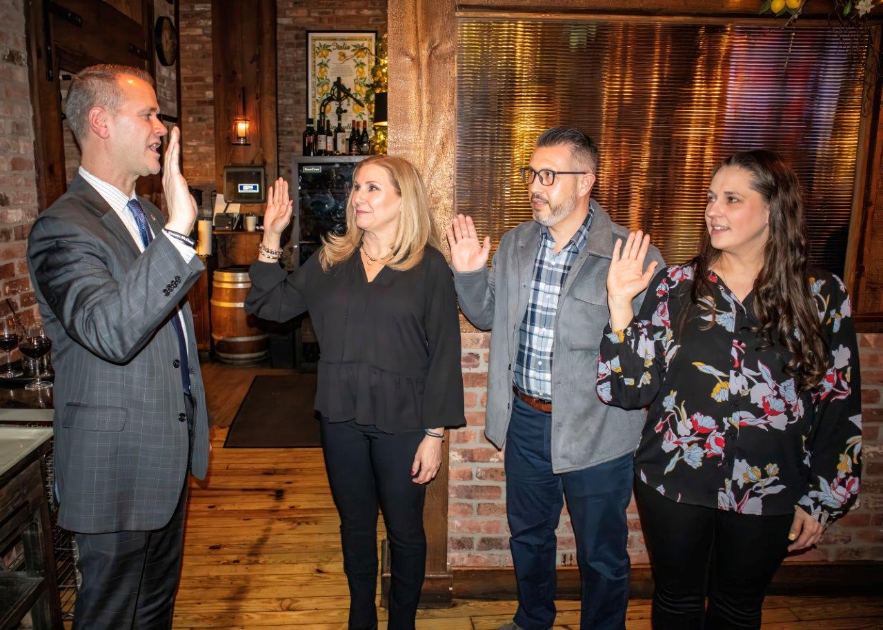 (L-R) Malverne Mayor Tim Sullivan swearing in Malverne Chamber of Commerce Treasurer Dr. Maria Casvikes, Social Media Lead Benny Montalbano and Recording Secretary Stephanie Fitzpatric.