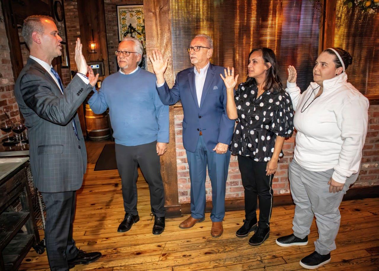 Malverne Mayor Tim Sullivan swearing in Malverne Chamber of Commerce Trustees Leon Sanchez, Jack Sorrentino, Dr. Evelyn Heredia and Victoria Tiso.