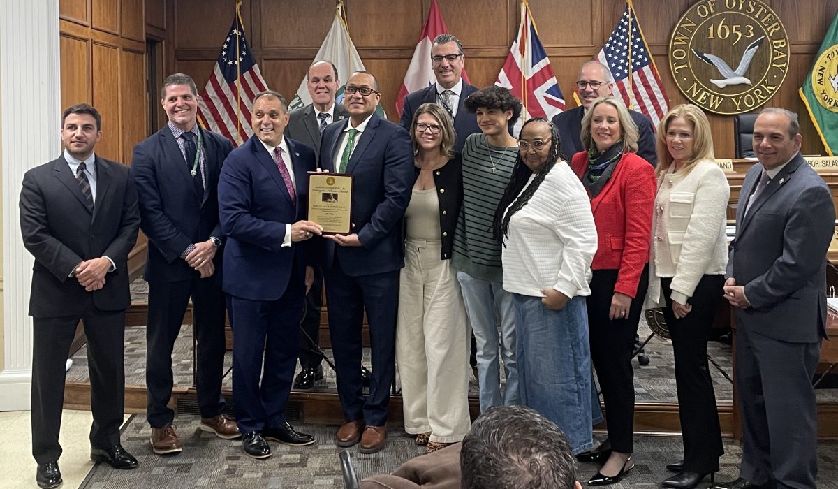 Samuel Thompson with his family and Town of Oyster Bay Board.