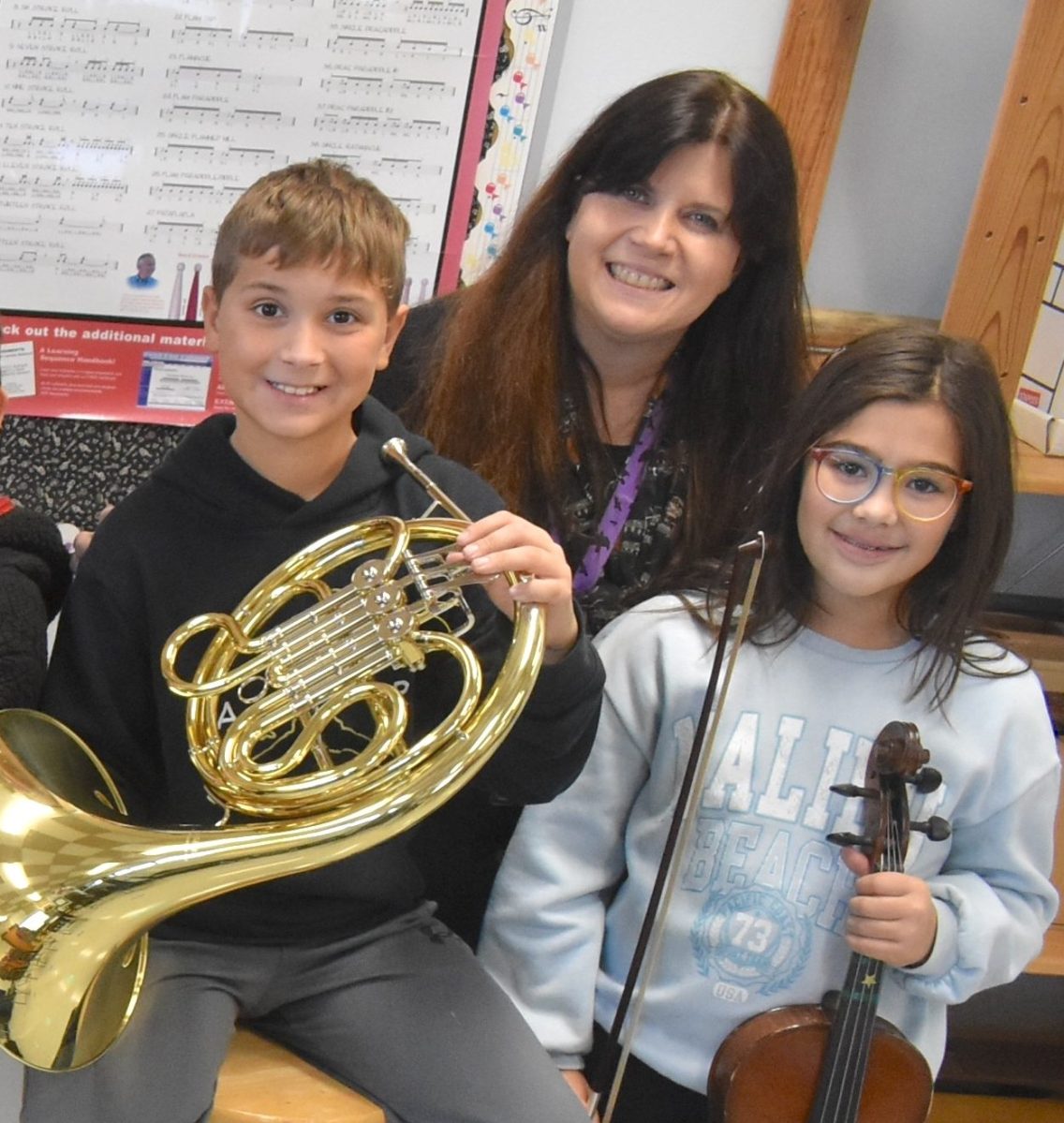 East Lake Elementary School music teachers Gina Aspetti, Amanda Collins and Debbie Burkart congratulate this year’s All-County music students.