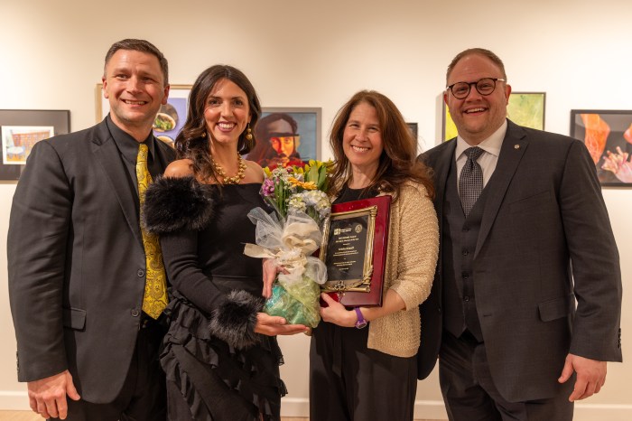 From left to right, Joe Cerutti, director of the Barbershop Harmony Society, Kristin Howell, Meredith and Jeff Glomboski of the Barbershop Harmony Society