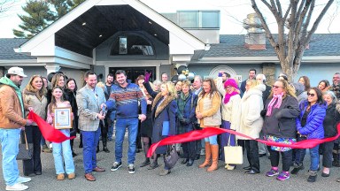 The Marker Restaurant Co-Owners Eric Telese and Kent Monkan celebrate their ribbon cutting with City of Glen Cove officials, business leaders, family and friends, and community members.