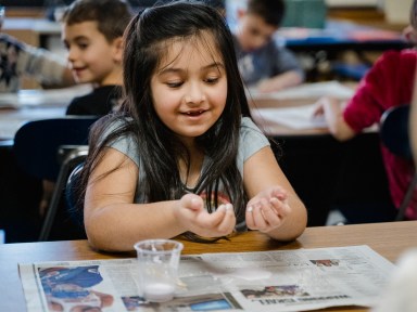 Students learned that when squeezed, oobleck feels like a solid, forming a ball in your hand.