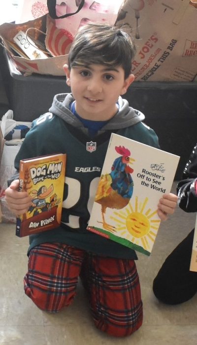 Fifth graders held count and sort the 1,500-plus books that were donated.