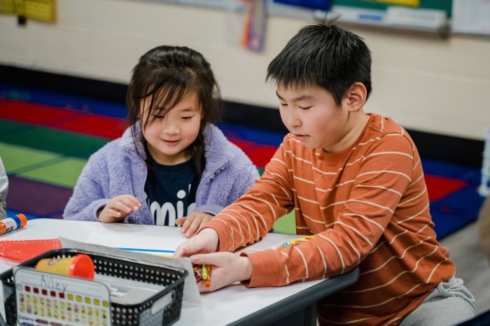 students from the lower grades at Charles Campagne School teamed up with “buddies” from the older grades to make valentines for children in the hospital.