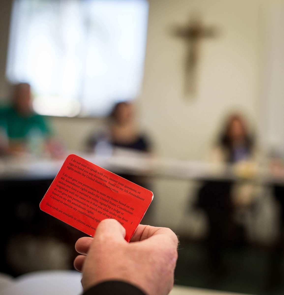 Local community members are educating immigrants and other community members on their rights if they face an ICE agent, including through handing out red cards with information