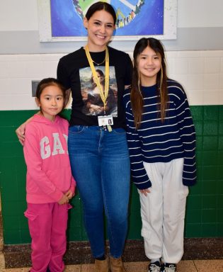 Hillside Grade School fourth grader Ellie Chen, art teacher Jenna Marotta and sixth grader Sophie Liu.