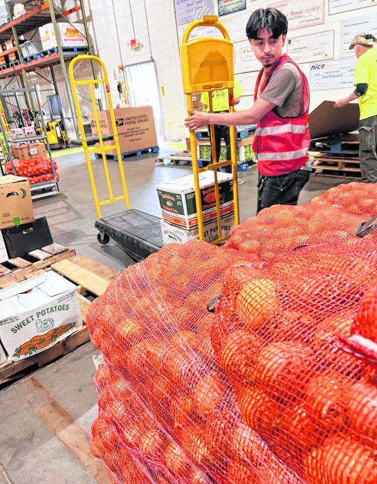 Island Harvest’s trainees at work. The job training program helps people find employment and avoid food insecurity.