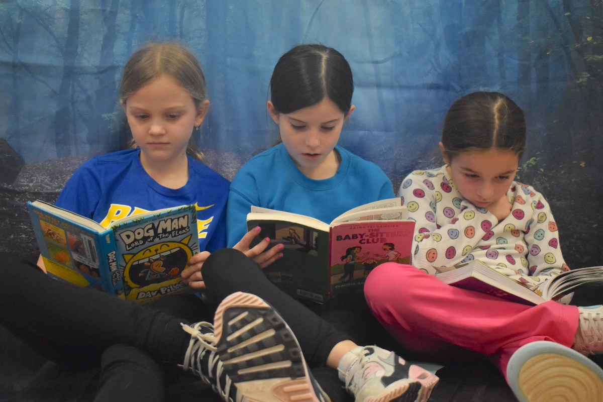 Emily Considine, left, Reagan Maeher and Angelina Sinatra were immersed in their books.