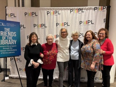 Pictured left to right, Books for Dessert Advisory Board Chair; Leader Evelyn Schonbrun; Author Susan Thompson; Leader Annemarie Benzinger; Port Washington Public Library Head of Adult Services Kate Monsour; and Advisory Board Member Elise May