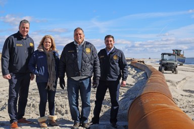 Town of Oyster Bay trustees at Tobay Beach which is receiving 90,000 tons of sand