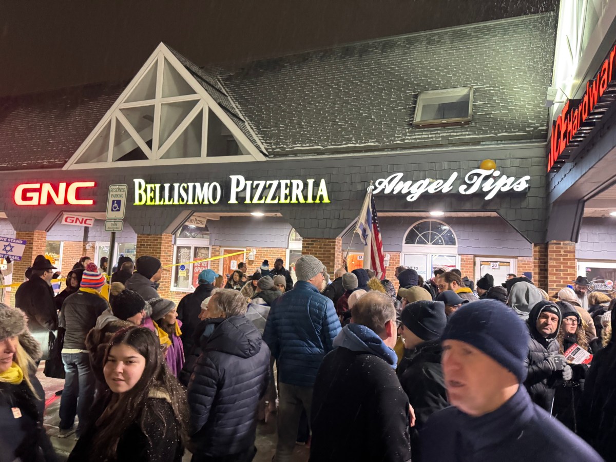 Nearly 200 protestors gathered outside Bellissimo Pizzeria in Port Washington for hosting a pro-Palestinian organization many protestors said promotes hate and anti-semitism