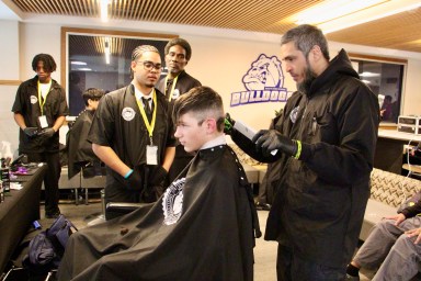 Members of the Barber and Beauty Institute of New York hosted the pop-up babershop event at Roslyn High School