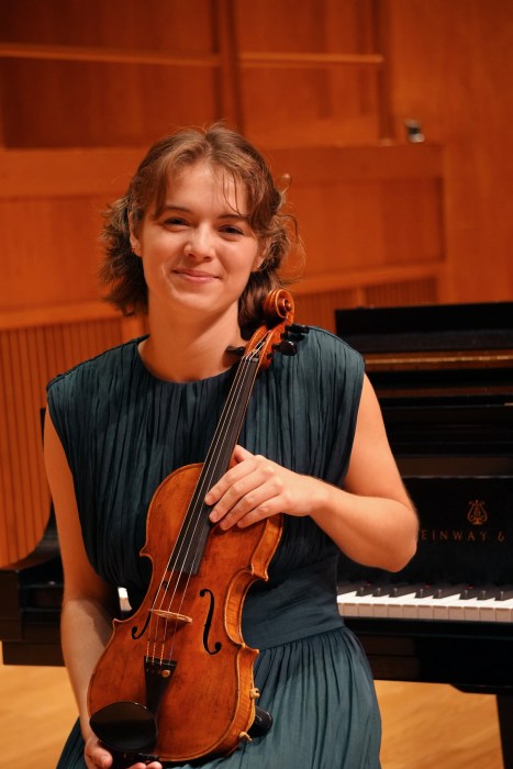 Classical violinist Chloë Dickens will be performing alongside her colleagues in the Alegría Ensemble of a new composition by Professor Emeritus Edward Smaldone of Manhasset.