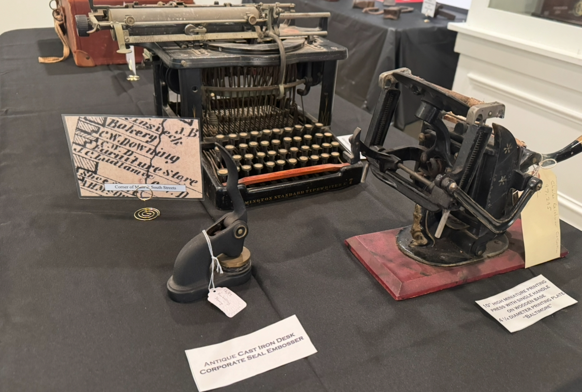 Typewriter and embossers on display at the historical society exhibit right now