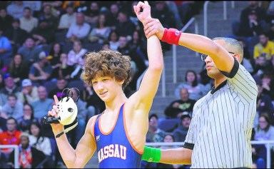 Colton Schmiesing placed no. 1 in the state wrestling championships, earning the first title in Oyster Bay High School wrestling program history