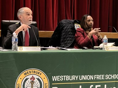 School board president Robert Troiano and Superintendent Tahira A. DuPree Chase speaking at the Tuesday, March 11 meeting