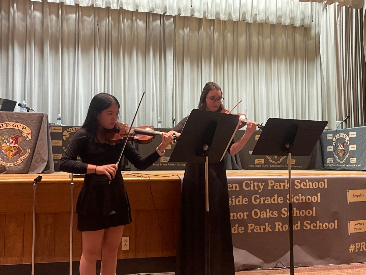 First Violinist Katalina Fung, a student from Garden City Park, and her teacher Alyssa Budzynski performing at the New Hyde Park Road School for Music in Our Schools Month.