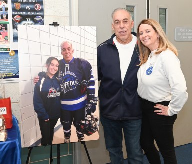 John and Mara Navaretta, left, with a photo of Sabrina Navaretta